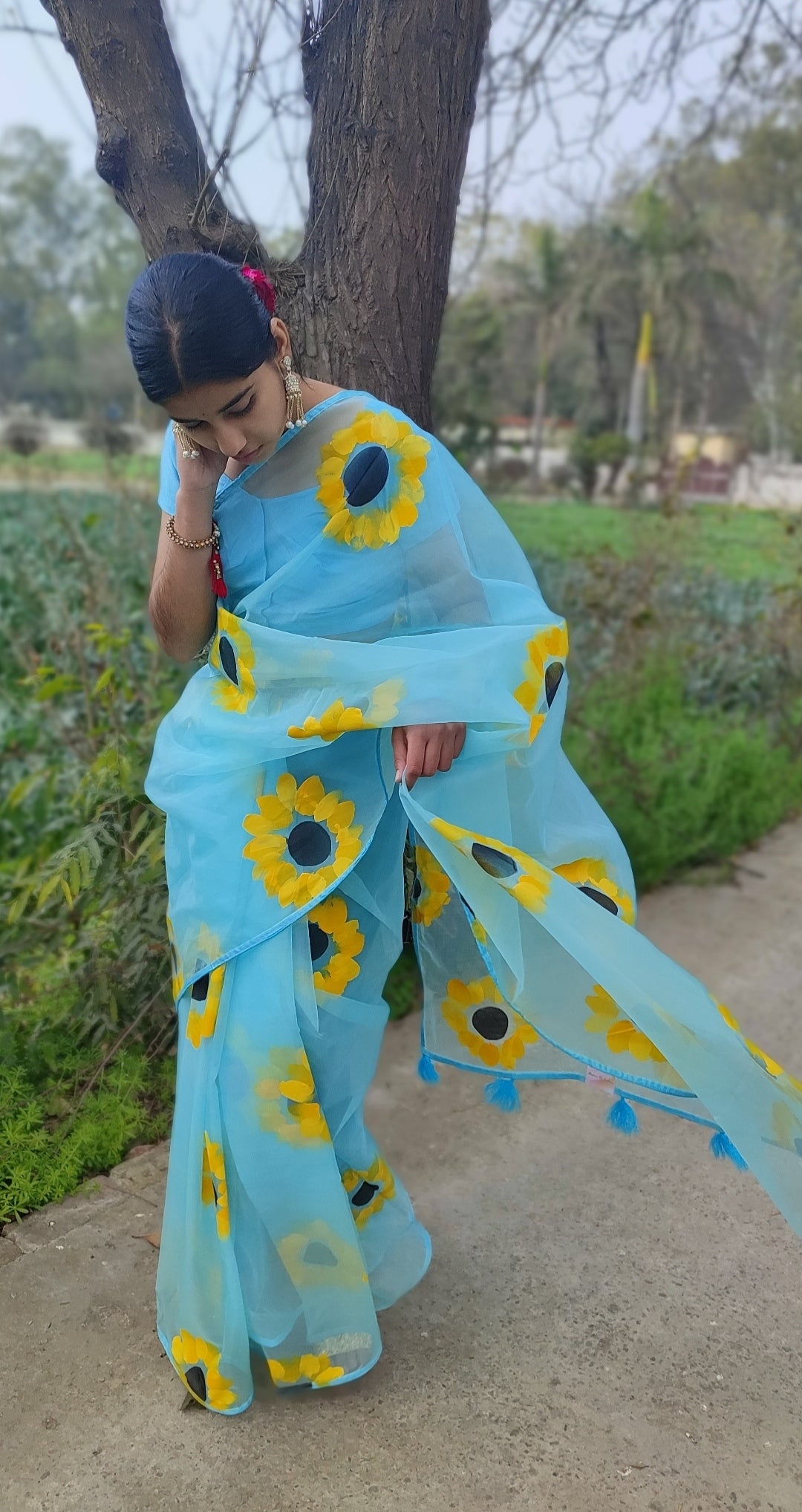 Sky blue Hand-painted organza saree with tassels