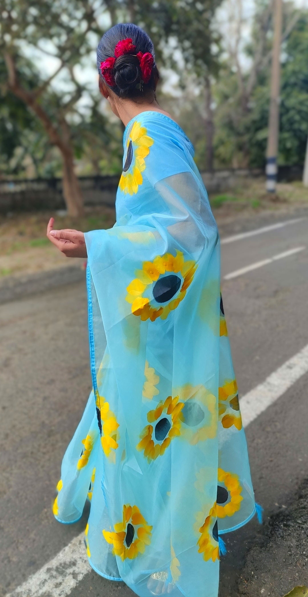 Sky blue Hand-painted organza saree with tassels