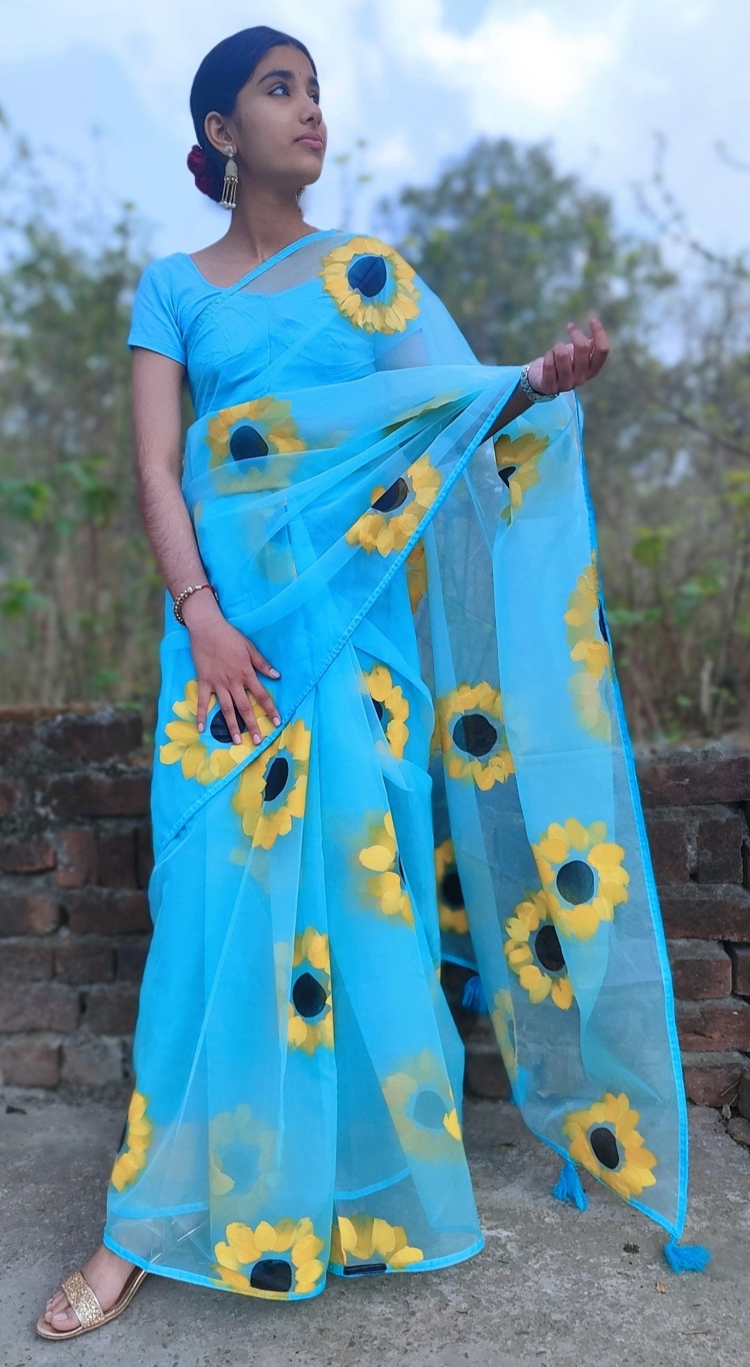 Sky blue Hand-painted organza saree with tassels