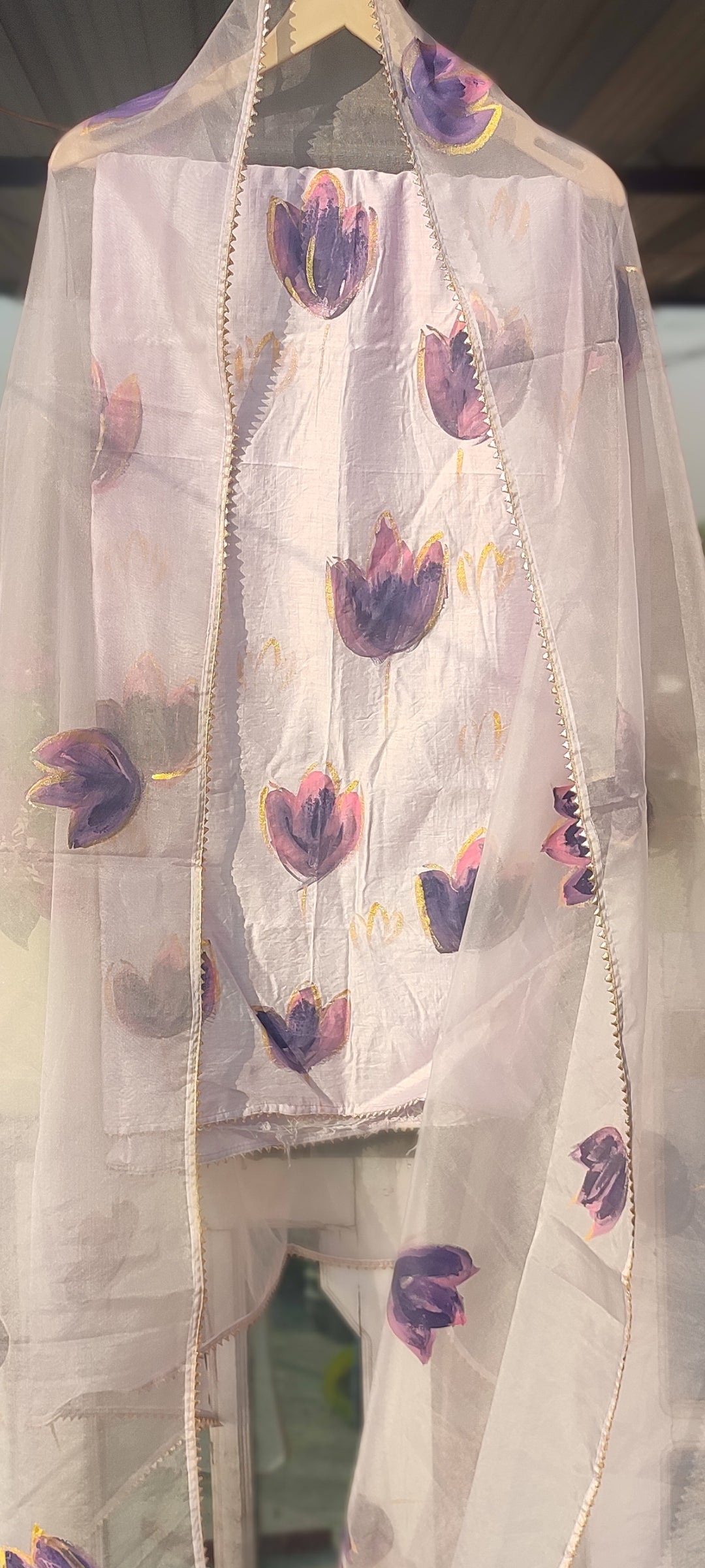 Hand painted purple chanderi silk suit with organza dupatta.