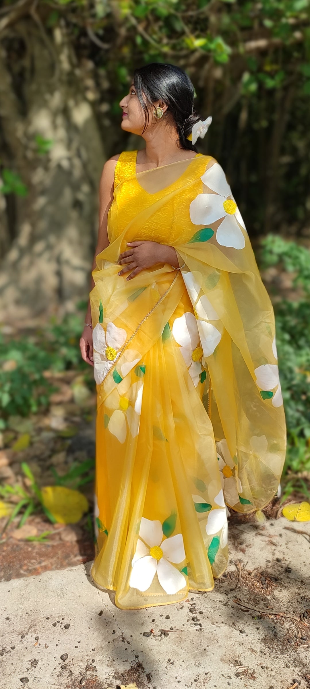 Yellow Handpainted organza saree with white tassels