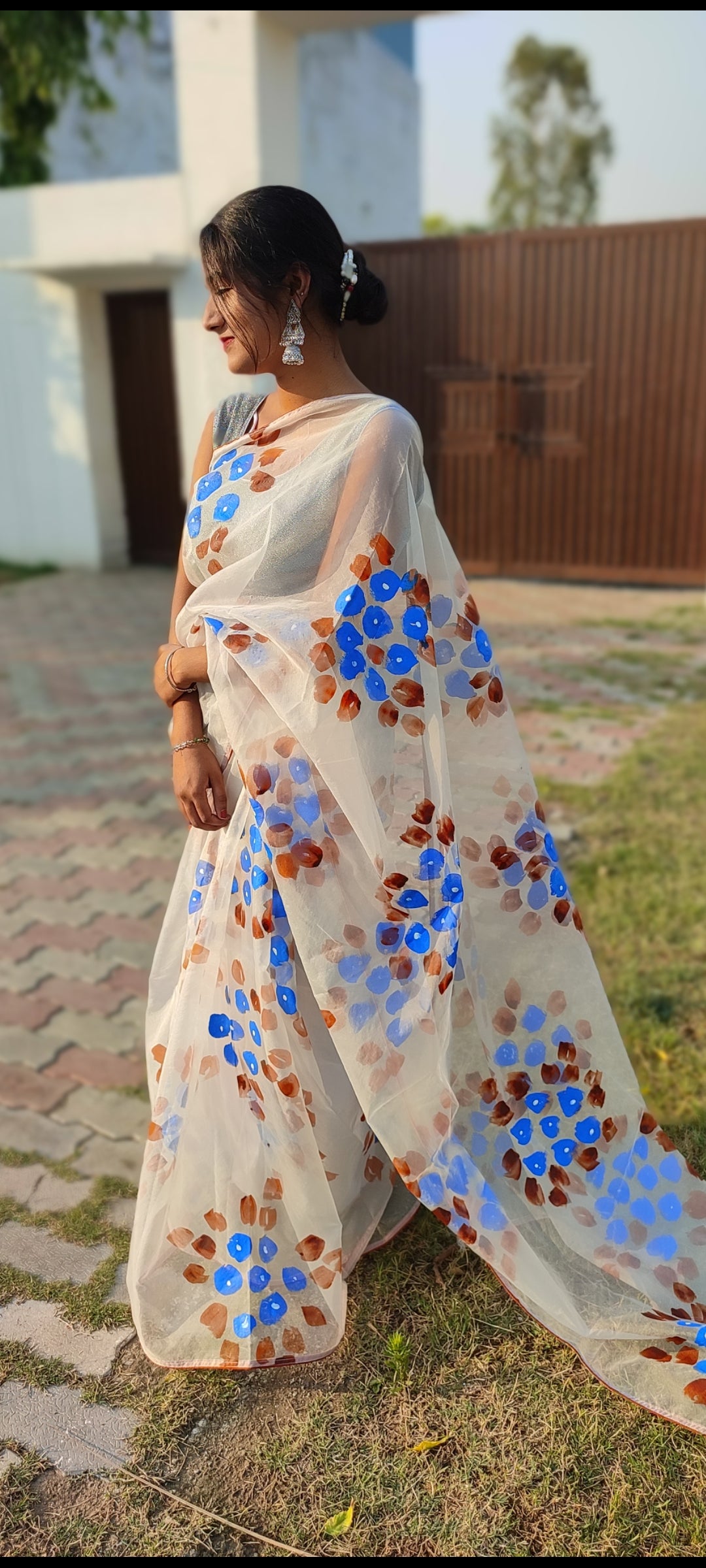 Handpainted white organza saree with tassels
