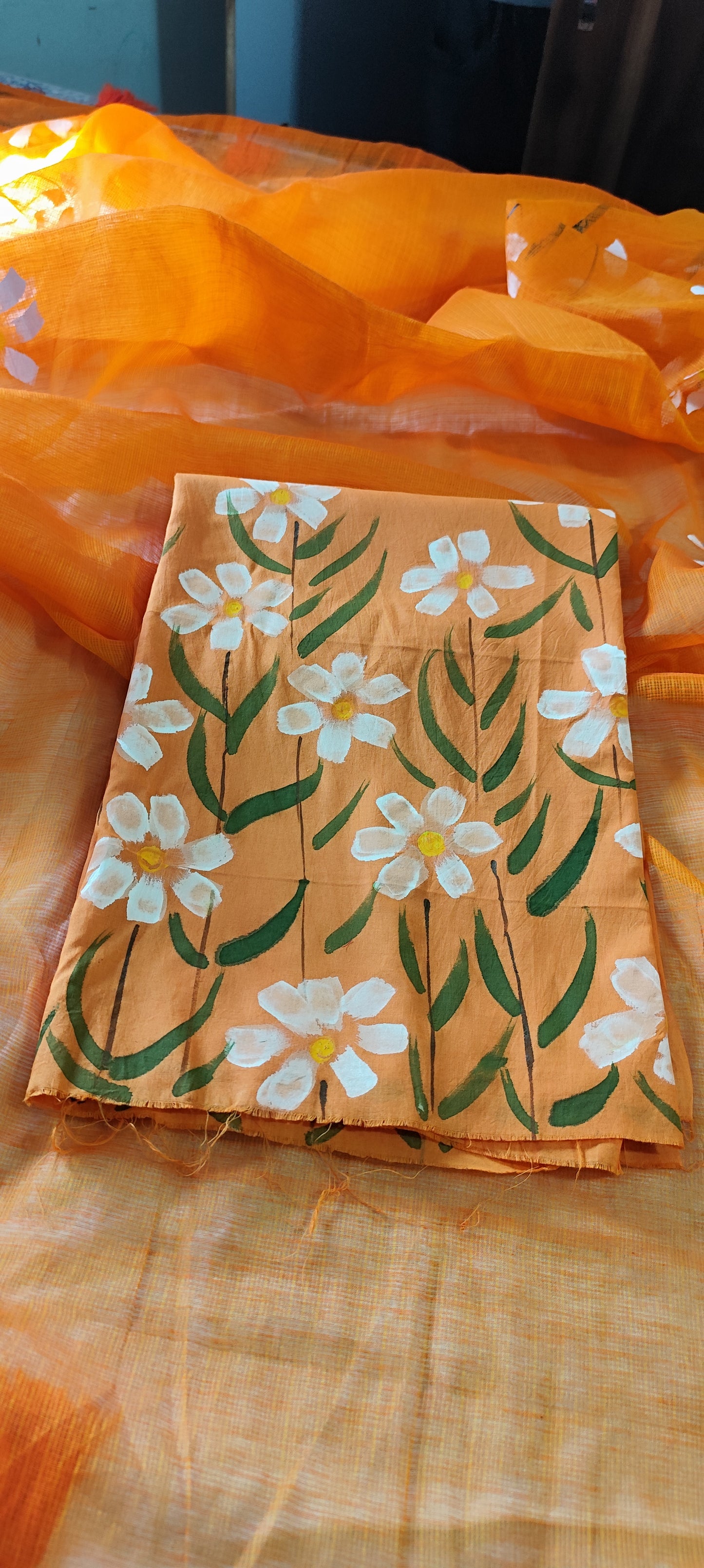 Handpainted orange pure cotton suit with white blossoms and kota doria dupatta