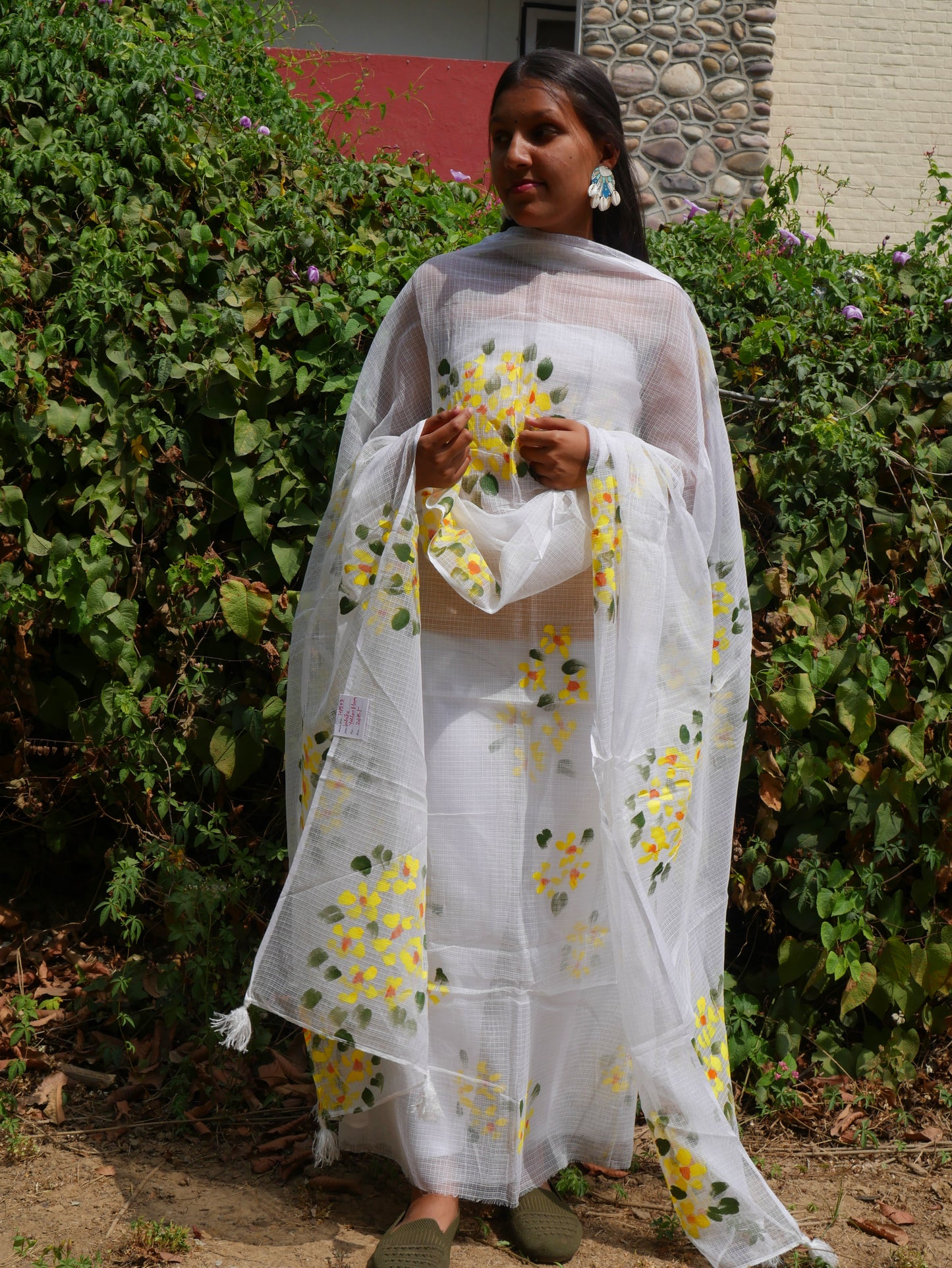 Hand-painted white pure kota doria suit with yellow flowers.