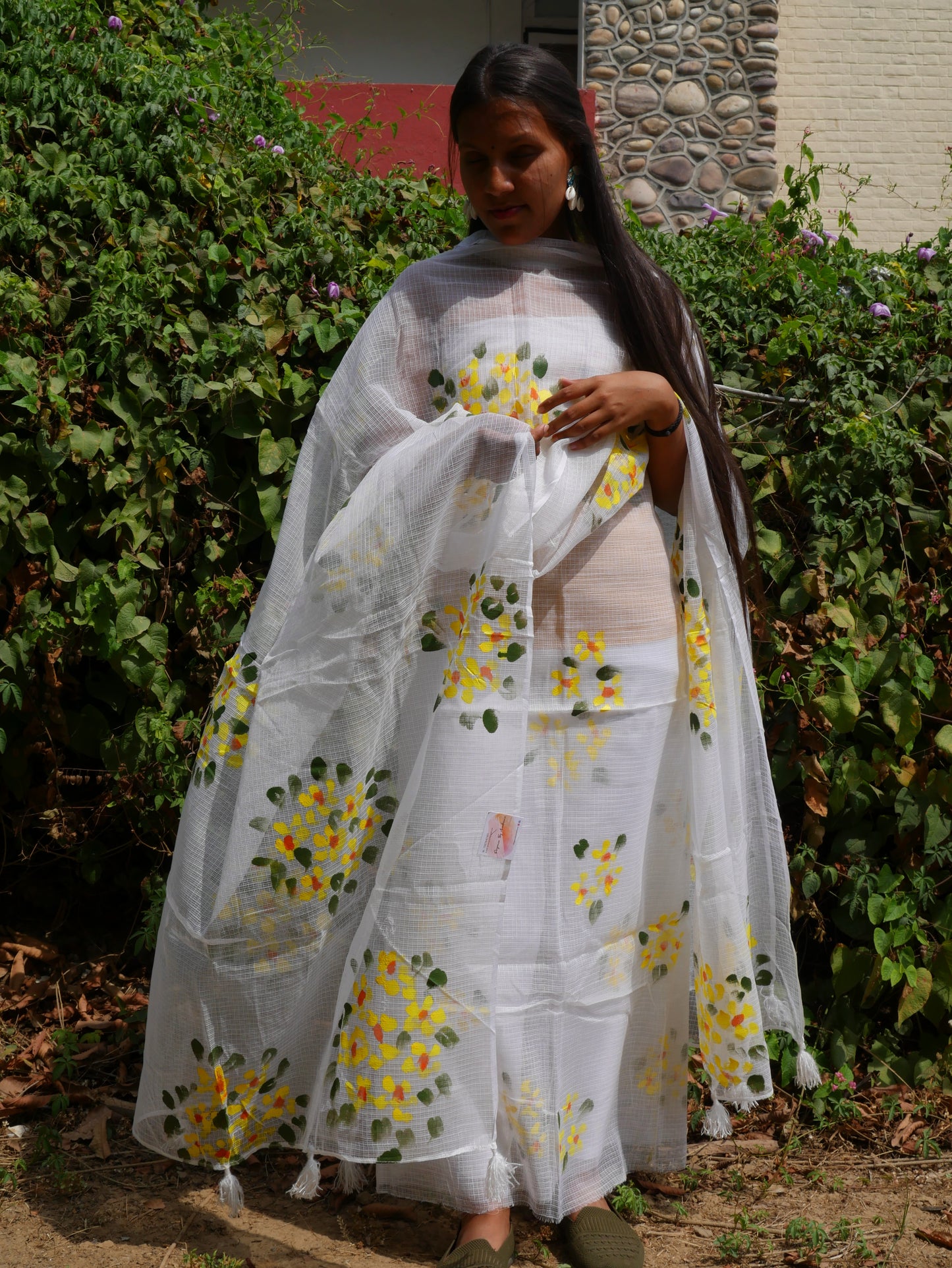 Hand-painted white pure kota doria suit with yellow flowers.