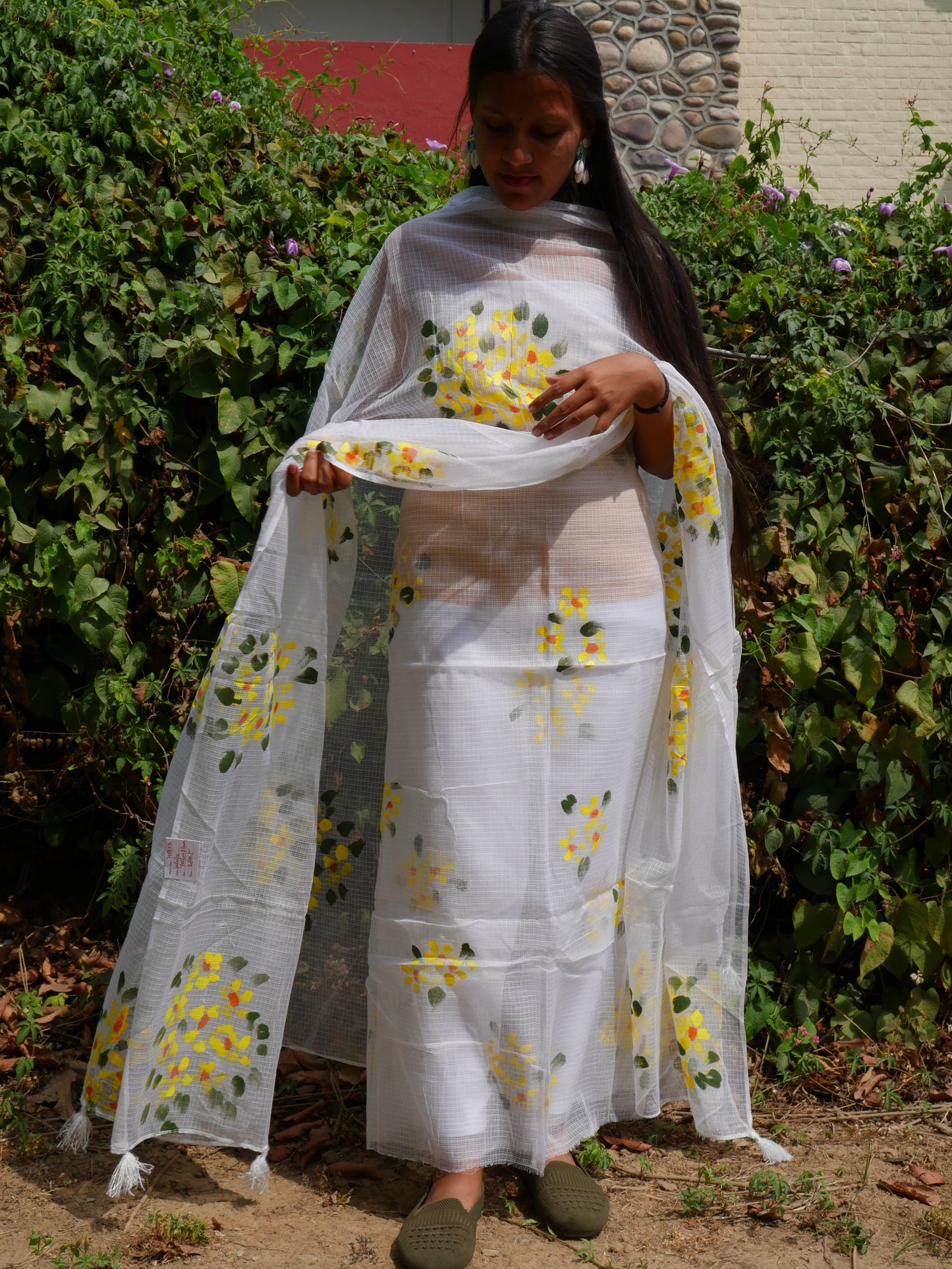 Hand-painted white pure kota doria suit with yellow flowers.