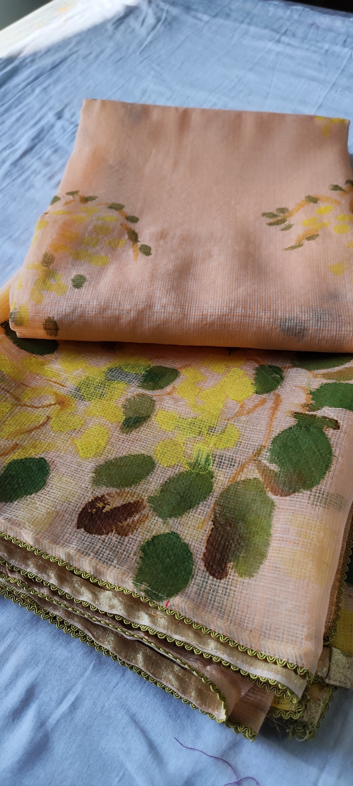 Handpainted amaltas on peach kota doria suit