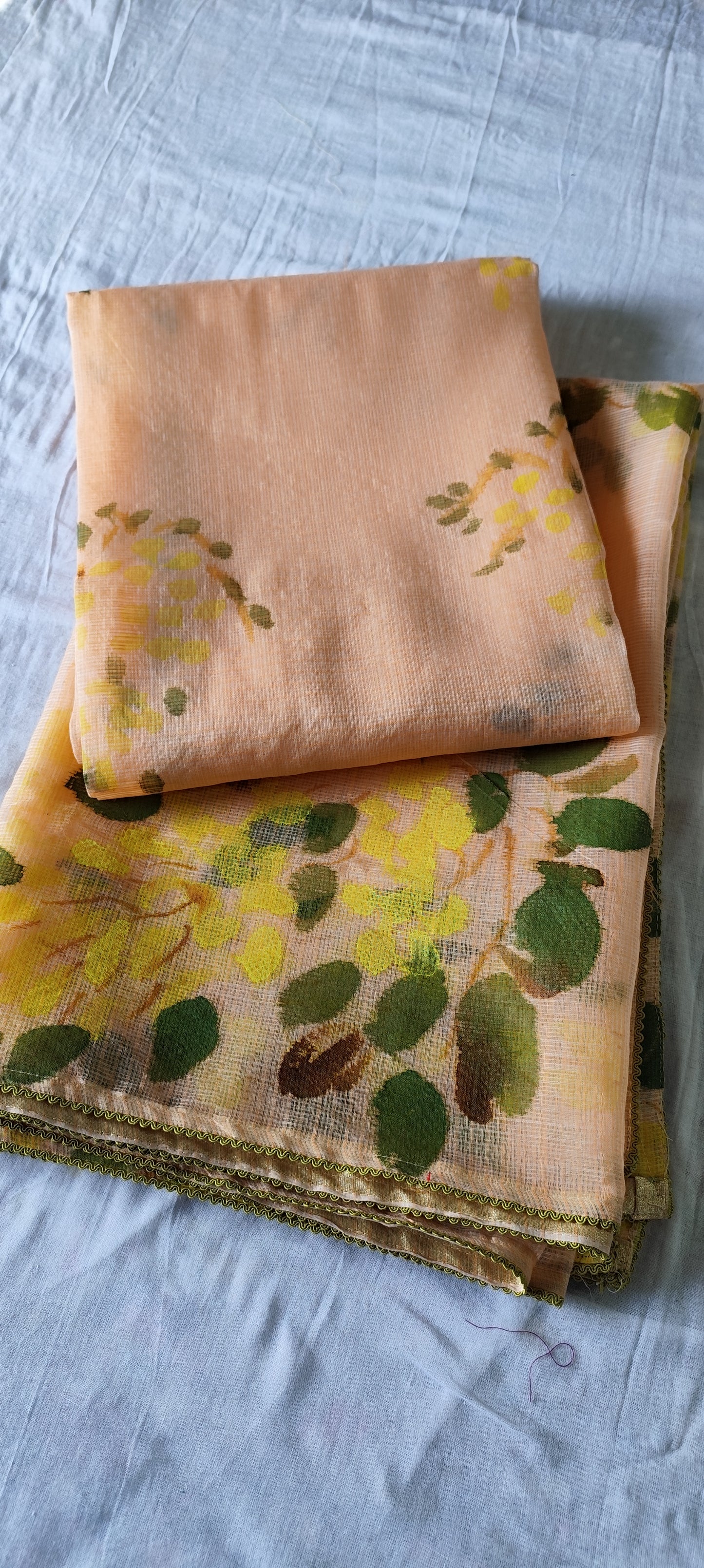 Handpainted amaltas on peach kota doria suit